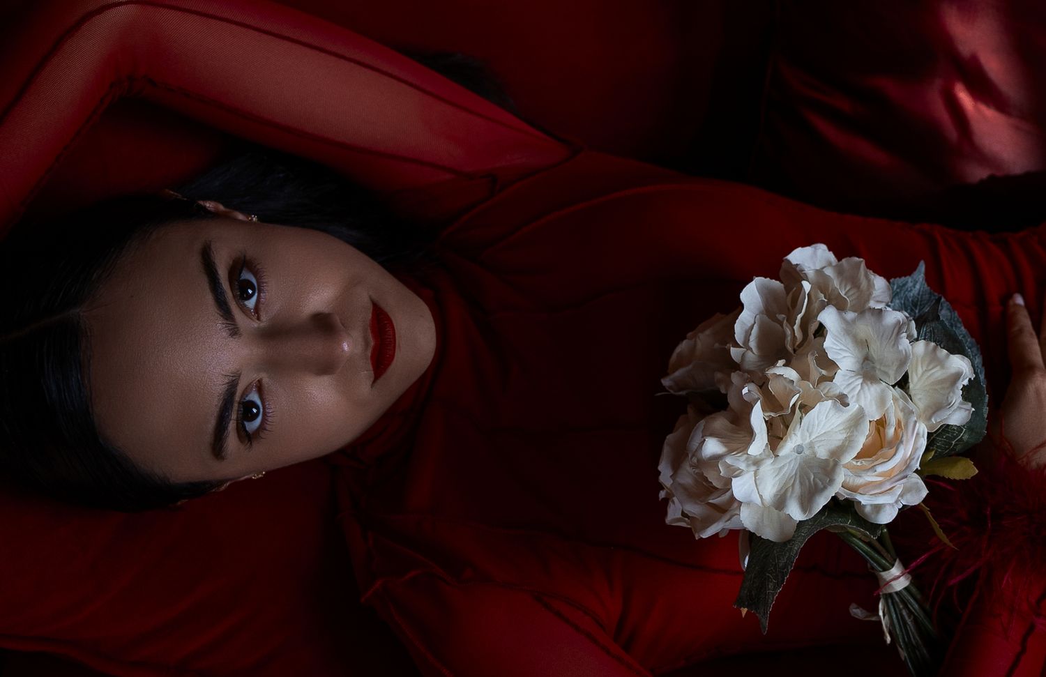 Editorial portrait in deep red light